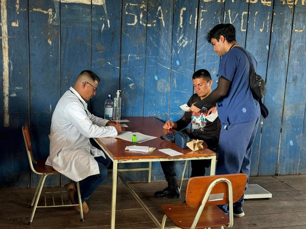 person speaking with the doctor