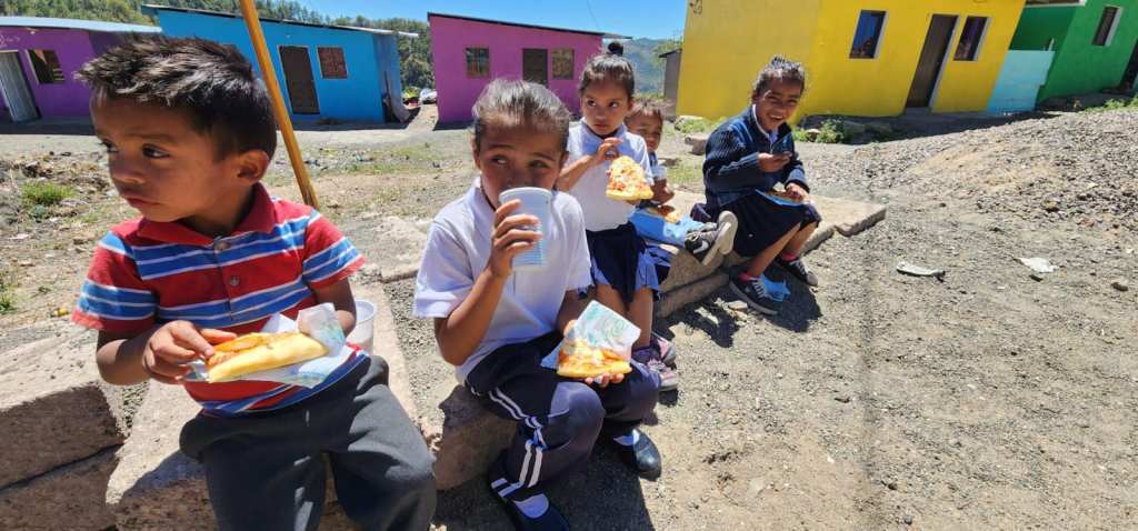 small children eating food