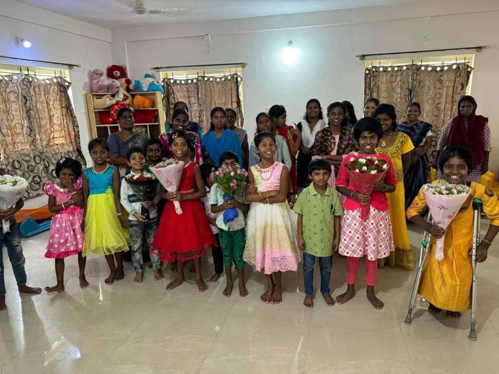 a group of people holding flowers