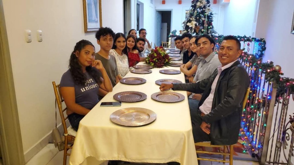 people sitting on a food table